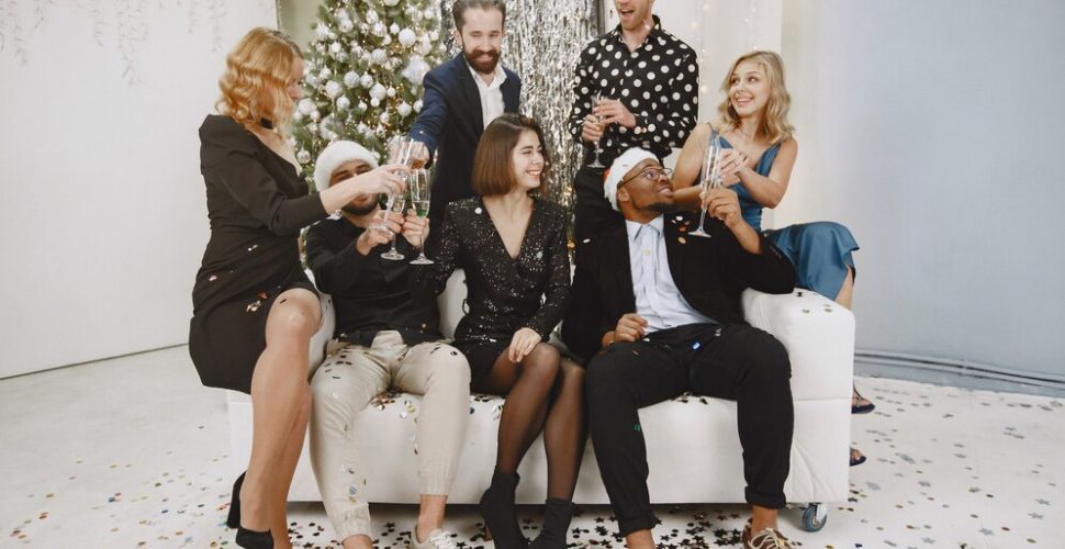 group-young-people-celebrating-new-year-friends-drinks-champagne_1157-43166