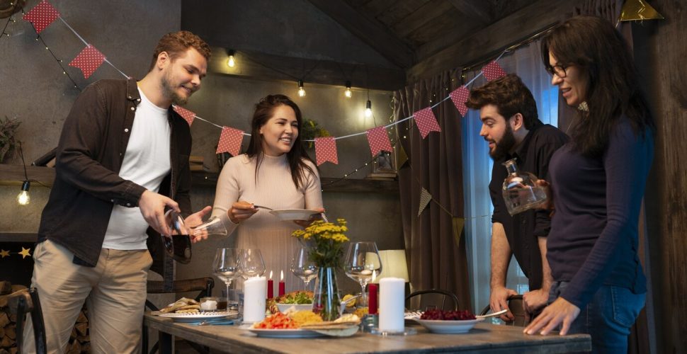medium-shot-happy-friends-having-dinner_23-2149882893
