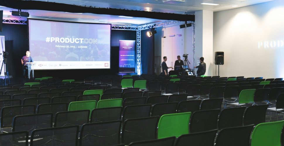 Presentation screen setup at modern corporate event venues for seminars and product launches.